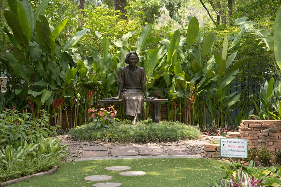 Tranquil memorial statue in the beautiful green spaces of Princess Mother Memorial Park, perfect for family visits