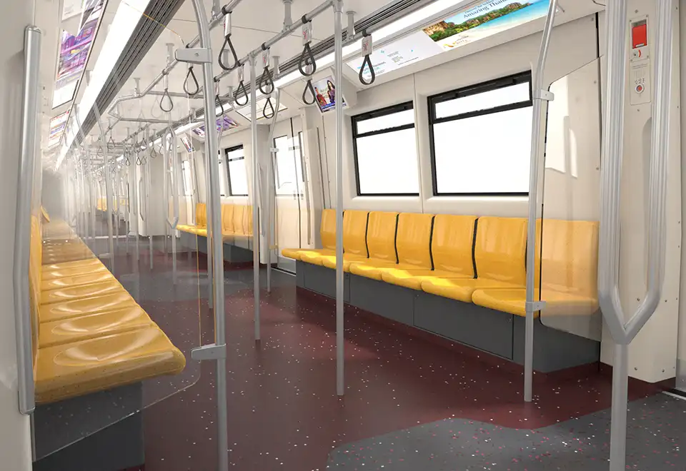 Inside a BTS train car with its characteristic yellow seats and plenty of standing room
