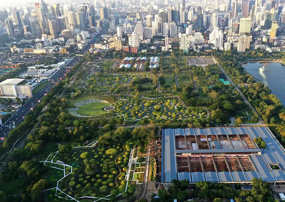 Landscape art and city towers converge at Benjakitti Park, a tranquil spot for budget explorers.