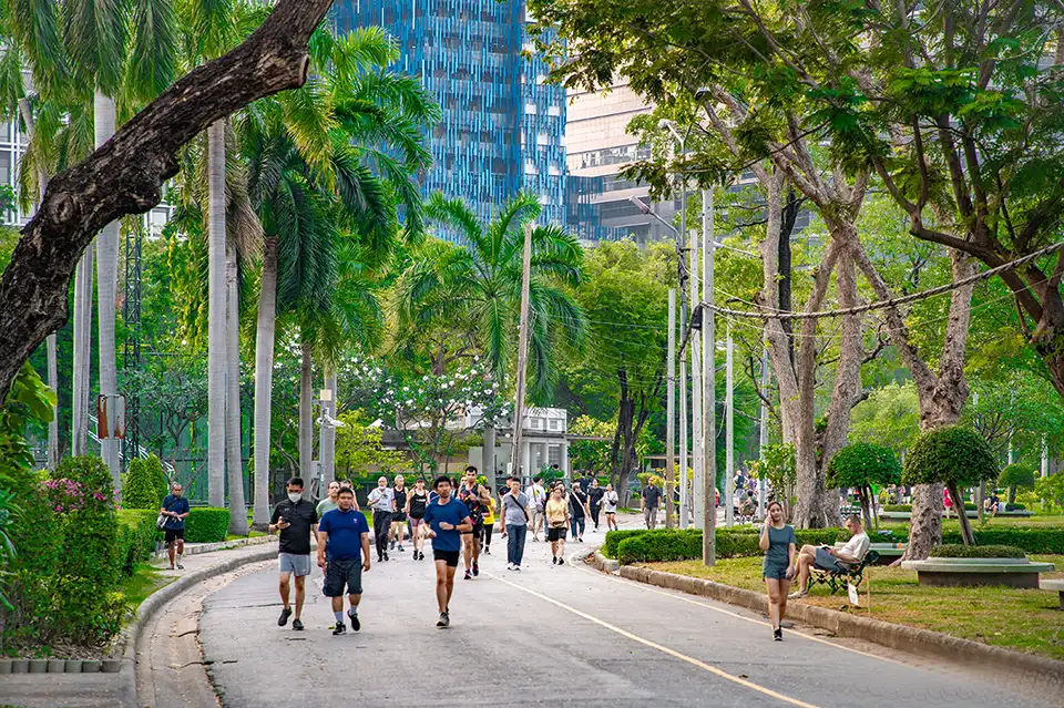 Green paths and skyline views—Lumphini Park offers a peaceful break in the heart of Bangkok.