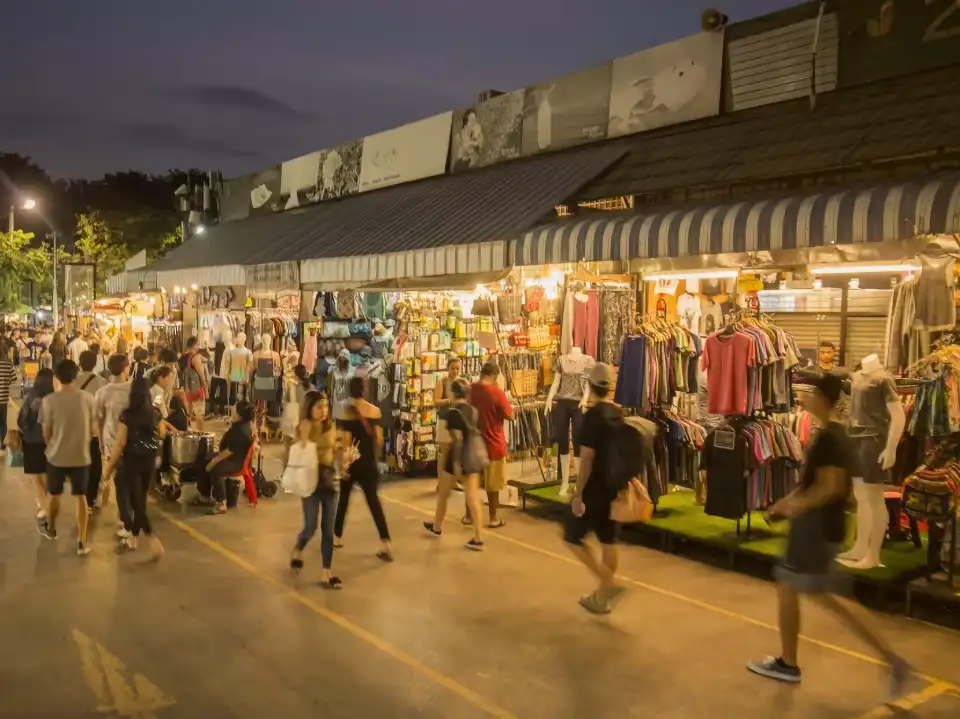 Crowds wander through Chatuchak’s glowing aisles—fashion, fun, and street style for less.