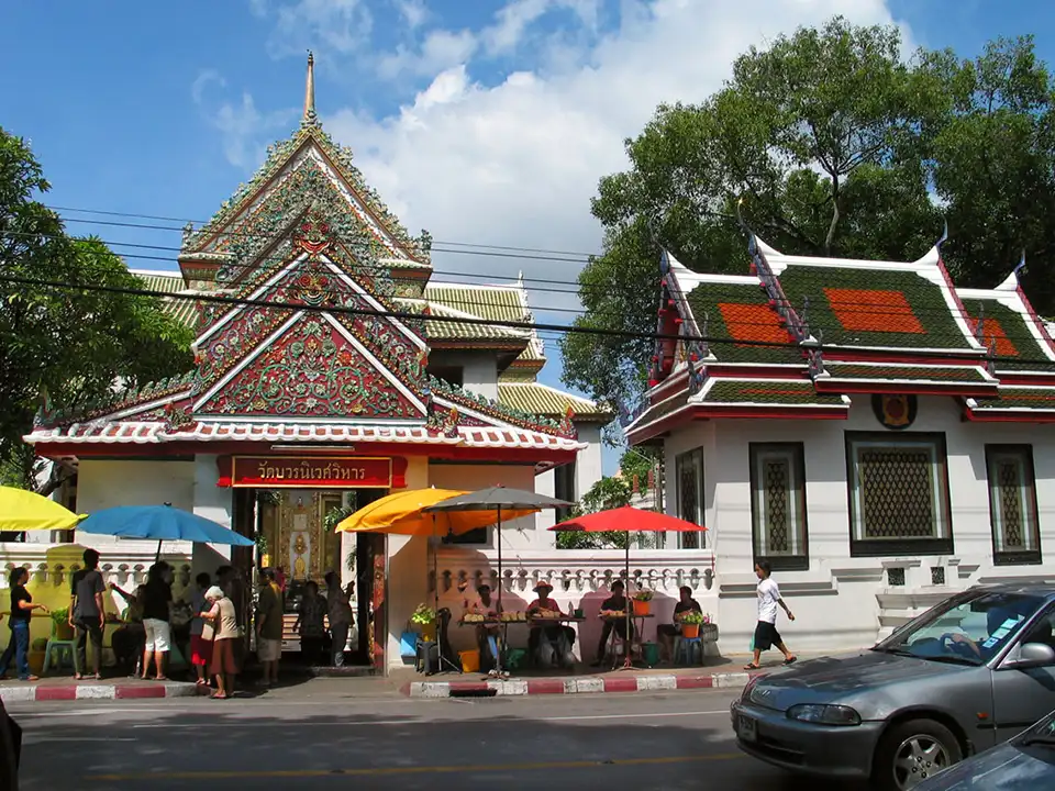 Ornate temple rooflines and bustling street vendors—Wat Bowonniwet offers a rich slice of Bangkok for free.