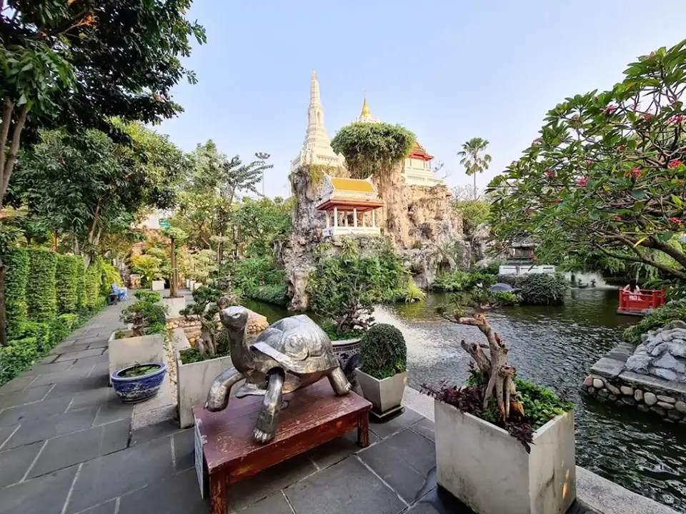 Hidden gem in Bangkok: Wat Prayoon’s tranquil garden and temple spires, perfect for budget-friendly cultural escapes.