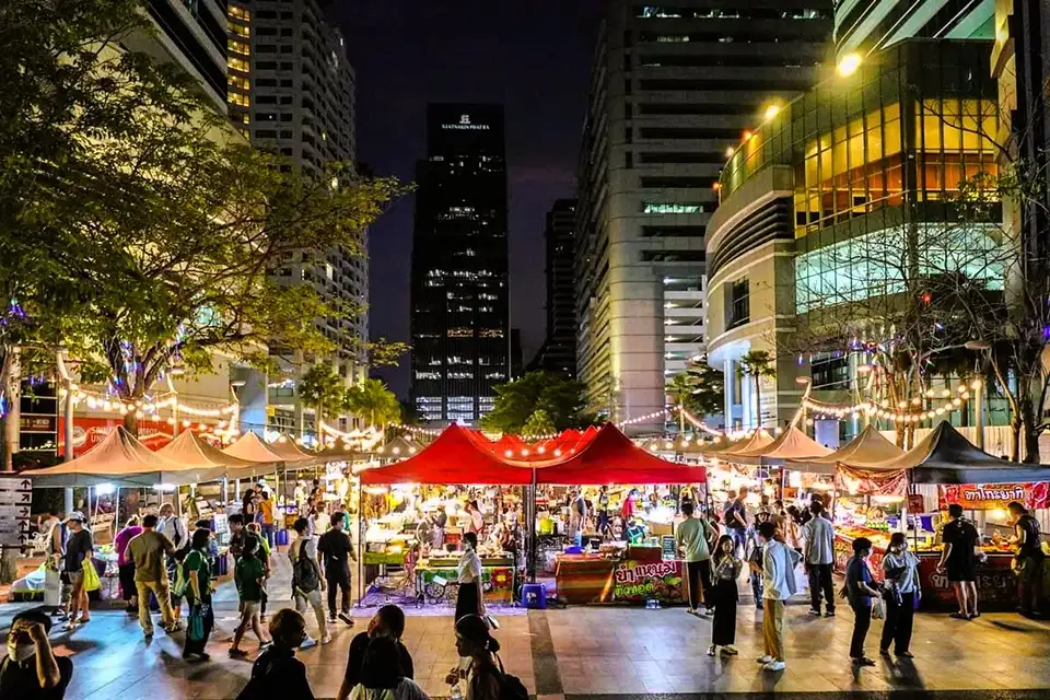 Midnight food tour in full swing—colorful stalls, city lights, and hungry explorers.