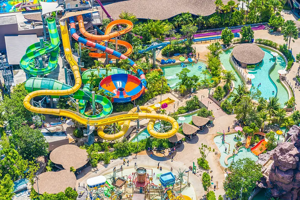 Family Trip in Pattaya: Bird's eye view of Columbia Pictures Aquaverse featuring winding water slides, lazy river, and various pools perfect for families