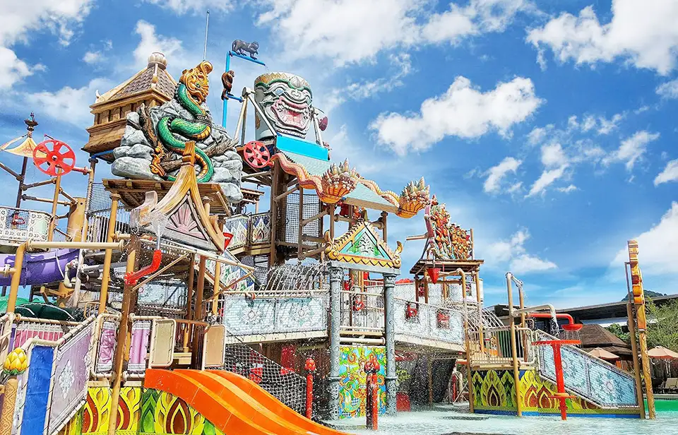 Family Trip in Pattaya: Family-friendly water play structure at Ramayana Water Park showcasing traditional Thai art and design with slides and water activitiesFamily-friendly water play structure at Ramayana Water Park showcasing traditional Thai art and design with slides and water activities