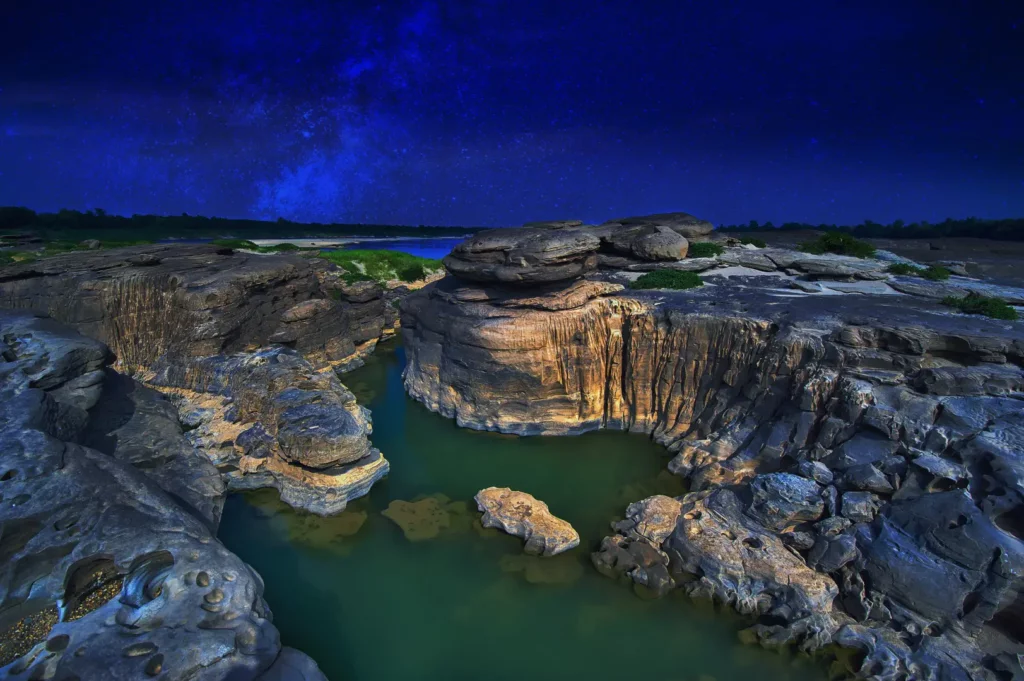 Hidden Thailand: Eroded rock formations and pools under the Milky Way at Hat Chom Dao, Ubon Ratchathani